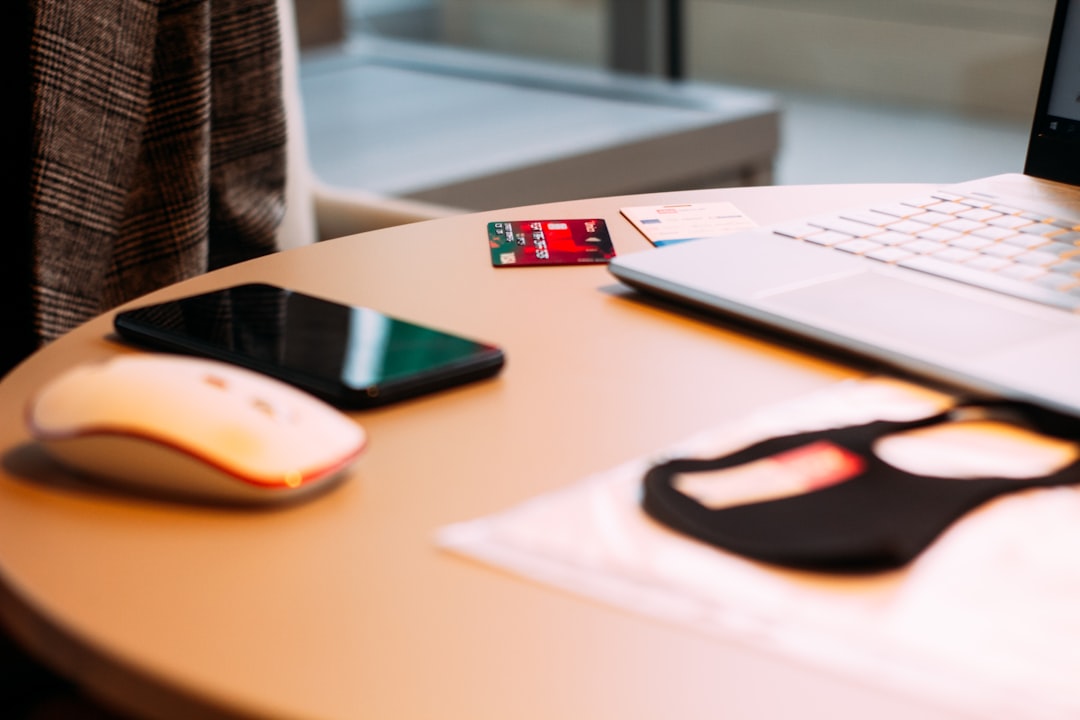 A minimalist flat lay of house keys and a sleek calculator on a modern desk, symbolizing the process of calculating real estate commissions and making a financially-savvy choice.